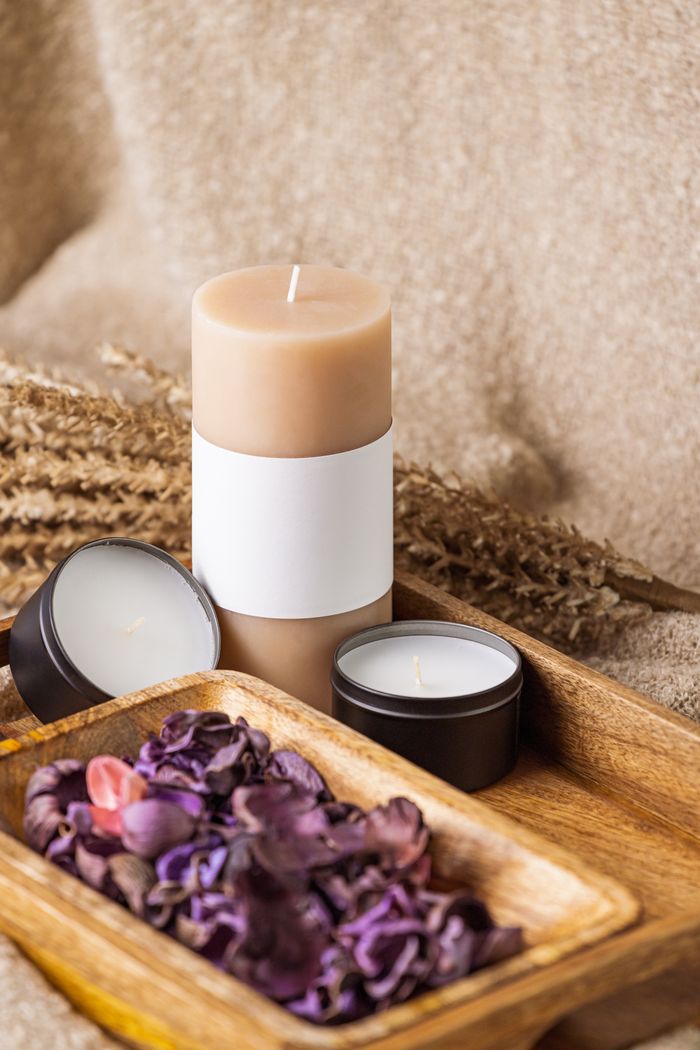 Scented candles and dried flowers, representing freshening treatment