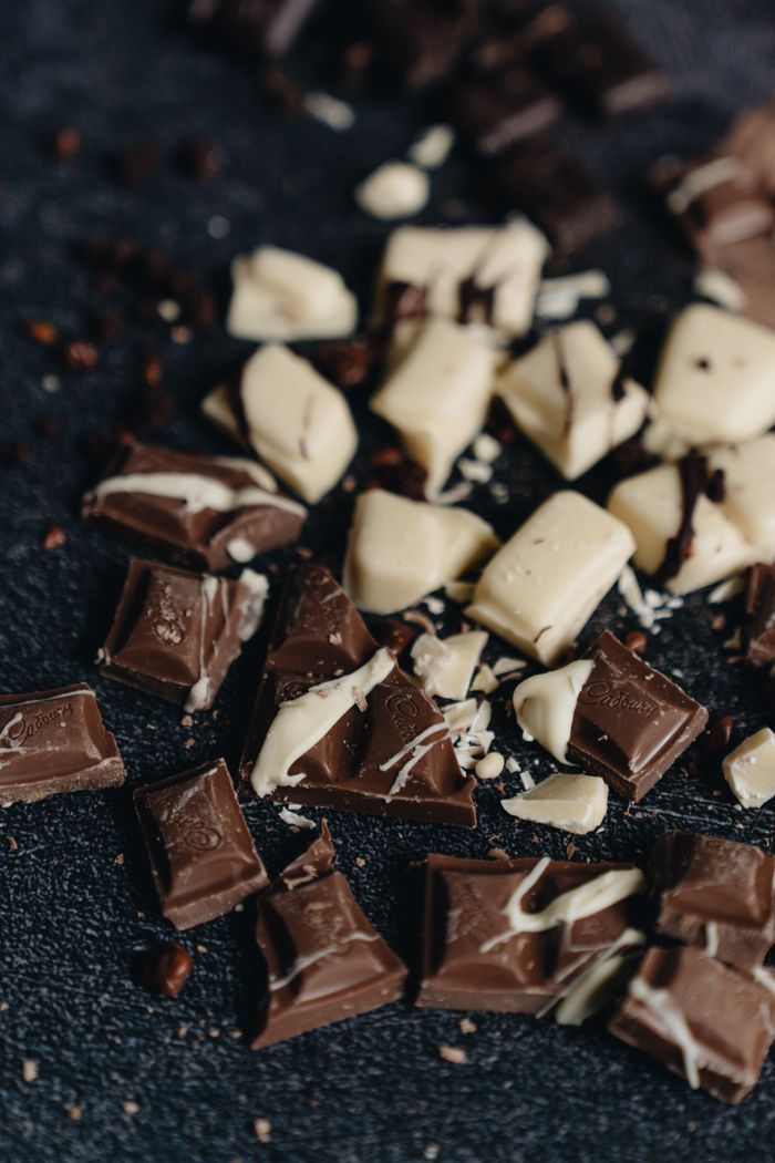 Broken pieces of chocolate, representing chocolate stains