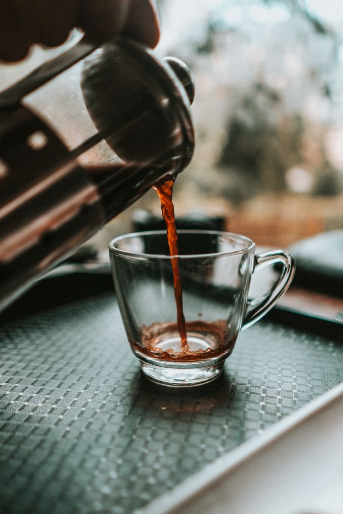 Coffee being poured, representing coffee and tea stains