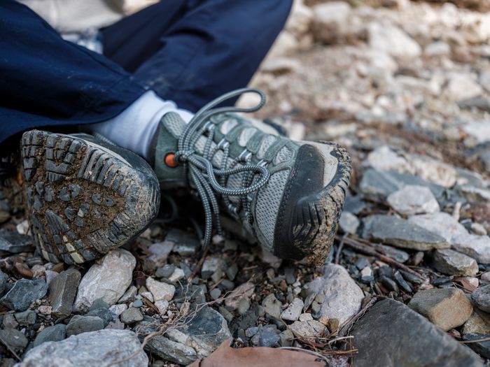 Muddy hiking boots, representing mud and soil marks