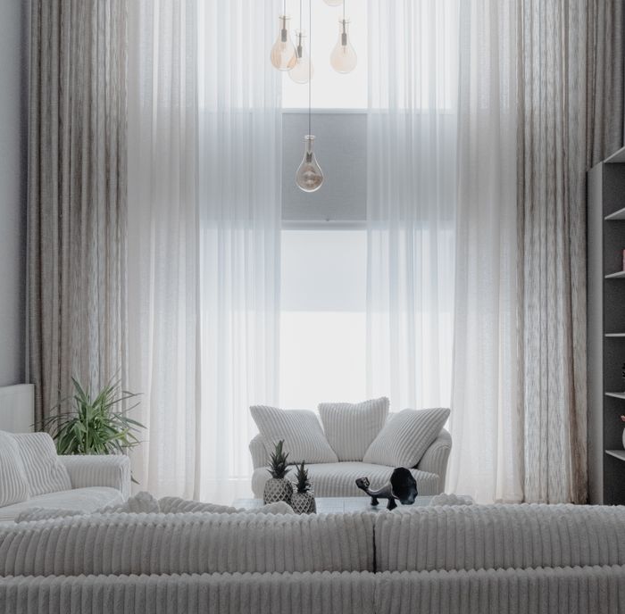 A bright, tidy living room with carpeted seating area
